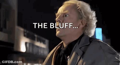 Man In Suit Standing In Front Of Building Saying The Bluff GIF