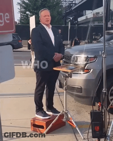 Man In Suit Standing In Front Of Car Saying Who GIF