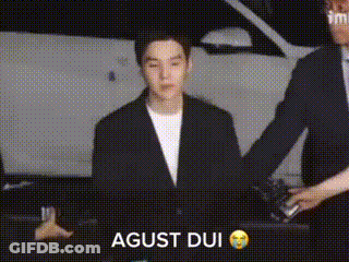 Man In Suit Standing In Front Of Car While Another Man Holds His Hand GIF