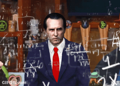 Man In Suit Standing In Front Of Chalkboard With Equations GIF