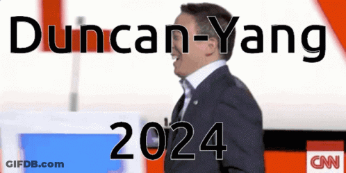 Man In Suit Standing In Front Of CNN Logo GIF