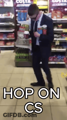 Man In Suit Standing In Front Of Costa Express Fridge GIF