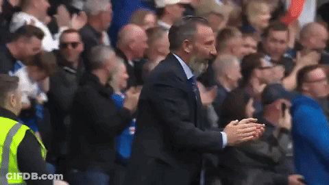 Man In Suit Standing In Front Of Crowd GIF