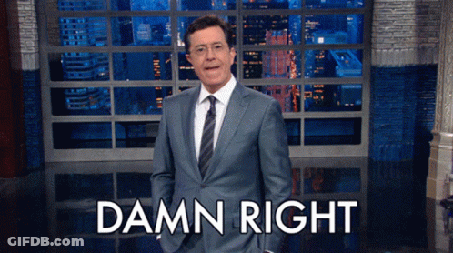 Man In Suit Standing In Front Of Damn Right Sign GIF