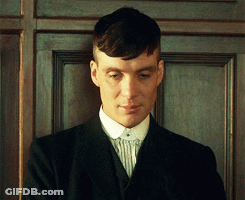 Man In Suit Standing In Front Of Door GIF