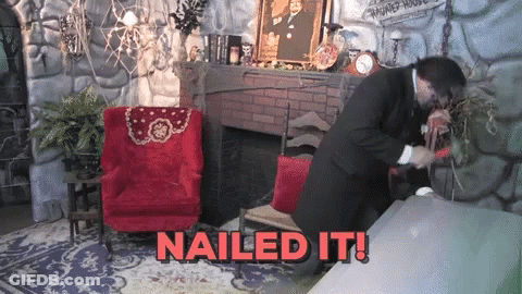 Man In Suit Standing In Front Of Fireplace Saying Nailed It GIF