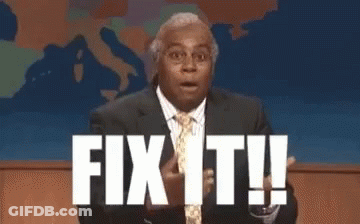 Man In Suit Standing In Front Of Fix It Sign GIF