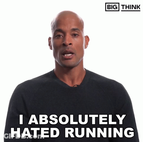 Man In Suit Standing In Front Of Jalen Milroe Football Screen GIF