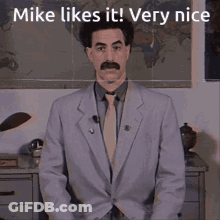 Man In Suit Standing In Front Of Map Saying Mike Likes It Very Nice GIF