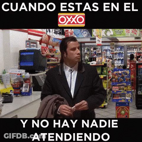 Man In Suit Standing In Front Of OXXO Sign GIF