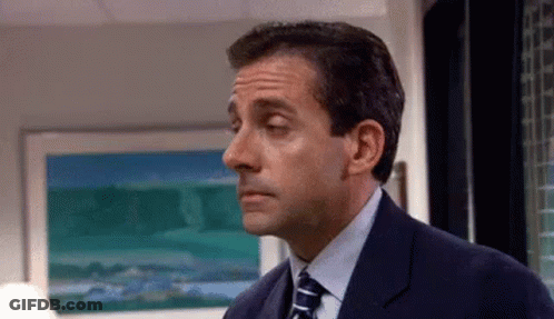 Man In Suit Standing In Front Of Painting GIF