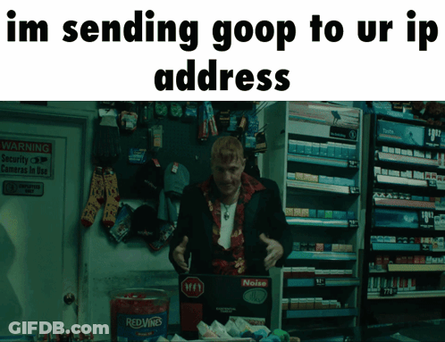 Man In Suit Standing In Front Of Red Wine Container GIF
