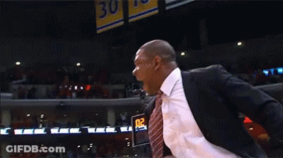 Man In Suit Standing In Front Of Scoreboard Saying 02 0 GIF