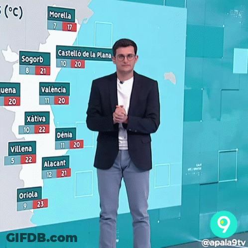 Man In Suit Standing In Front Of Temperature Map GIF