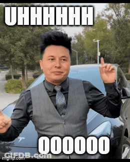 Man In Suit Standing In Front Of Tesla Model T GIF
