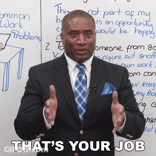 Man In Suit Standing In Front Of Whiteboard Saying That's Your Job GIF
