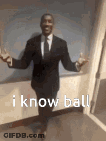 Man In Suit Standing In Hallway With Arms Outstretched GIF
