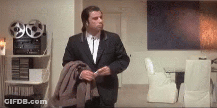 Man In Suit Standing In Living Room GIF