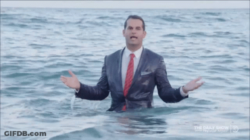 Man In Suit Standing In Water Daily Show GIF