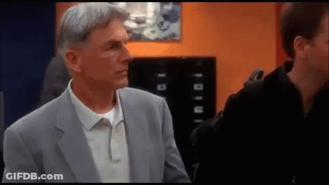 Man In Suit Standing Next To Another GIF