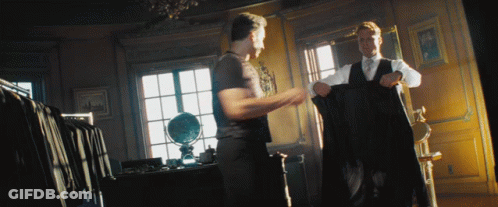 Man In Suit Standing Next To Another Man GIF