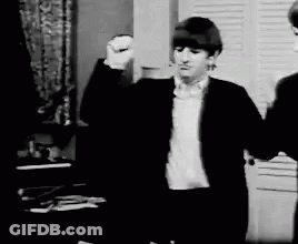 Man In Suit Standing Next To Another Man GIF