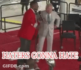 Man In Suit Standing Next To Another On Red Carpet Haters Gonna Hate GIF