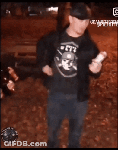 Man In Suit Standing Next To Exposing Friends Sign GIF