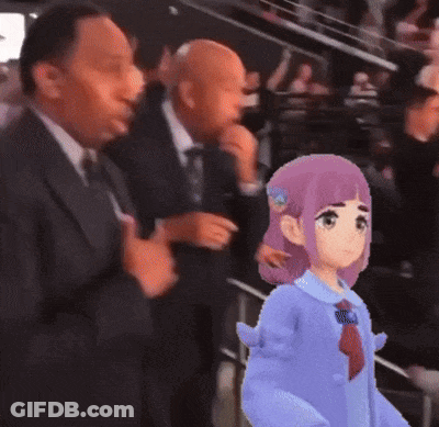 Man In Suit Standing Next To Girl In Blue Shirt GIF