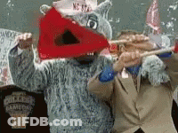 Man In Suit Standing Next To Shark Mascot GIF