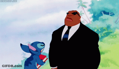 Man In Suit Standing Next To Stitch GIF