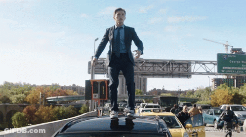 Man In Suit Standing On Car Roof By George Way Sign GIF
