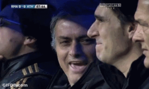 Man In Suit Standing On Soccer Field GIF