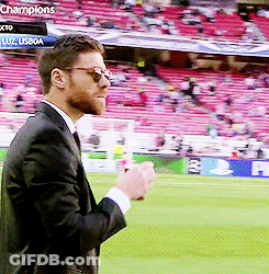 Man In Suit Standing On Soccer Field GIF