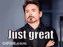 Man In Suit Standing With Arms Crossed Saying Just Great GIF