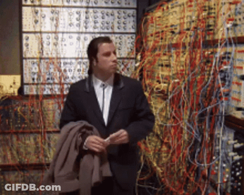 Man In Suit Standing With Numbered Wires GIF
