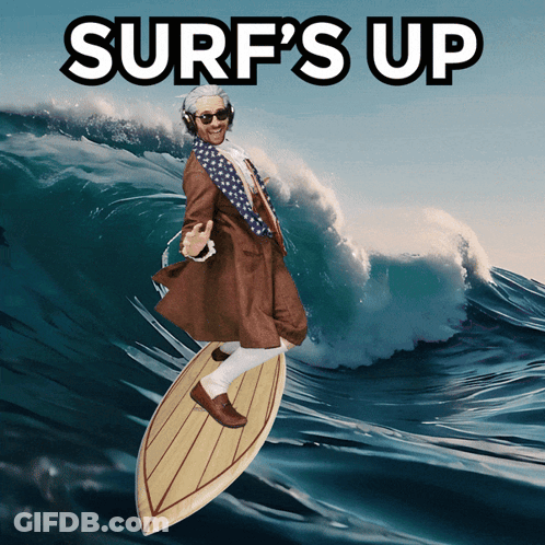 Man In Suit Surfing Wave Saying Surf's Up GIF