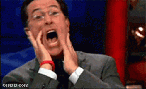 Man In Suit Surprised Hands On Face GIF