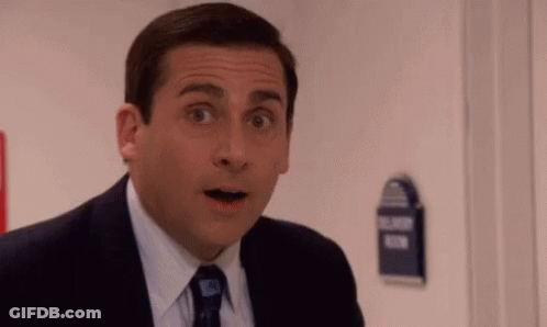 Man In Suit Surprised In Front Of Door GIF