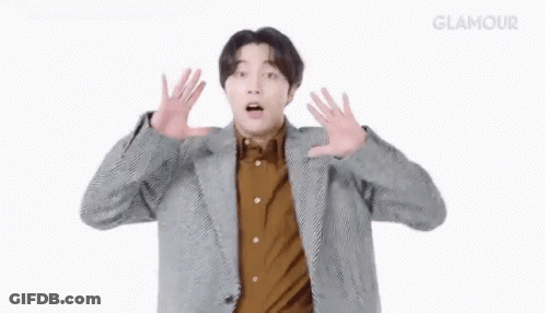 Man In Suit Surprised With Hands GIF