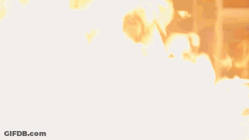 Man In Suit Surrounded By Flames GIF