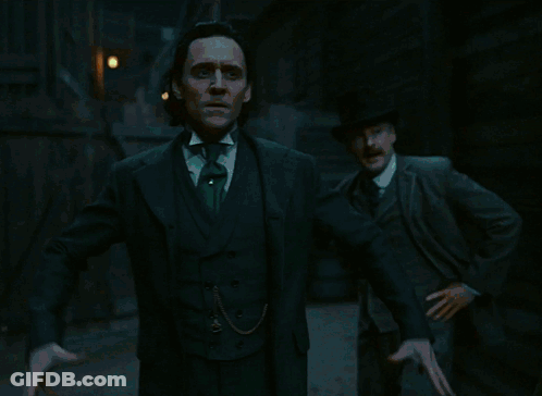 Man In Suit Surrounded By Green Glowing Flames GIF