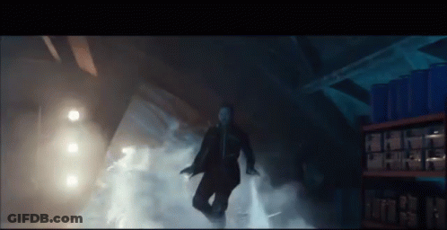 Man In Suit Surrounded By Smoke GIF