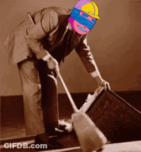 Man In Suit Sweeping Floor GIF