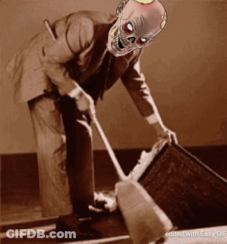 Man In Suit Sweeping With Zombie Mask GIF