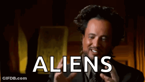 Man In Suit Talking About Aliens And Funny Face GIF