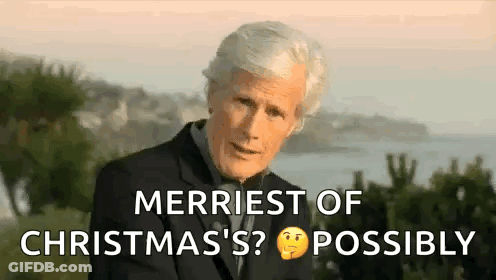 Man In Suit Talking About Christmas By Water GIF