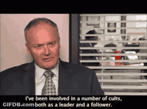 Man In Suit Talking About Cults GIF
