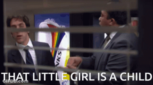 Man In Suit Talking Behind Girl GIF