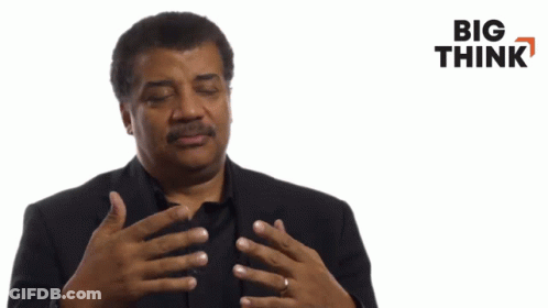Man In Suit Talking Big Think Sign GIF